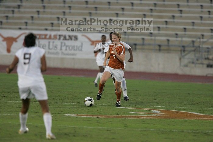 UT freshman Courtney Goodson (#7, Forward and Midfielder).  The University of Texas women's soccer team tied 0-0 against the Texas A&M Aggies Friday night, September 27, 2008.

Filename: SRM_20080926_1924203.jpg
Aperture: f/4.0
Shutter Speed: 1/500
Body: Canon EOS-1D Mark II
Lens: Canon EF 300mm f/2.8 L IS