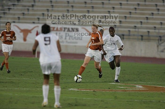 UT freshman Courtney Goodson (#7, Forward and Midfielder).  The University of Texas women's soccer team tied 0-0 against the Texas A&M Aggies Friday night, September 27, 2008.

Filename: SRM_20080926_1924204.jpg
Aperture: f/4.0
Shutter Speed: 1/640
Body: Canon EOS-1D Mark II
Lens: Canon EF 300mm f/2.8 L IS