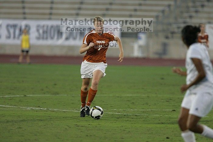 UT freshman Courtney Goodson (#7, Forward and Midfielder).  The University of Texas women's soccer team tied 0-0 against the Texas A&M Aggies Friday night, September 27, 2008.

Filename: SRM_20080926_1924247.jpg
Aperture: f/4.0
Shutter Speed: 1/500
Body: Canon EOS-1D Mark II
Lens: Canon EF 300mm f/2.8 L IS