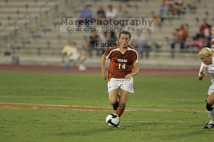 UT senior Kasey Moore (#14, Defender) brings the ball downfield.  The University of Texas women's soccer team tied 0-0 against the Texas A&M Aggies Friday night, September 27, 2008.

Filename: SRM_20080926_1935364.jpg
Aperture: f/4.0
Shutter Speed: 1/400
Body: Canon EOS-1D Mark II
Lens: Canon EF 300mm f/2.8 L IS