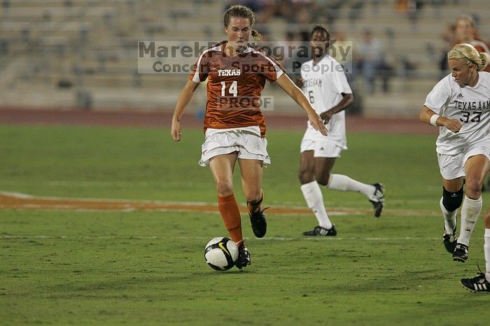 UT senior Kasey Moore (#14, Defender) brings the ball downfield.  The University of Texas women's soccer team tied 0-0 against the Texas A&M Aggies Friday night, September 27, 2008.

Filename: SRM_20080926_1935388.jpg
Aperture: f/4.0
Shutter Speed: 1/400
Body: Canon EOS-1D Mark II
Lens: Canon EF 300mm f/2.8 L IS