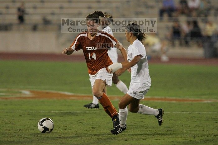 UT senior Kasey Moore (#14, Defender) brings the ball downfield.  The University of Texas women's soccer team tied 0-0 against the Texas A&M Aggies Friday night, September 27, 2008.

Filename: SRM_20080926_1935402.jpg
Aperture: f/4.0
Shutter Speed: 1/500
Body: Canon EOS-1D Mark II
Lens: Canon EF 300mm f/2.8 L IS