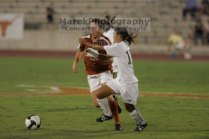 UT senior Kasey Moore (#14, Defender) brings the ball downfield.  The University of Texas women's soccer team tied 0-0 against the Texas A&M Aggies Friday night, September 27, 2008.

Filename: SRM_20080926_1935403.jpg
Aperture: f/4.0
Shutter Speed: 1/500
Body: Canon EOS-1D Mark II
Lens: Canon EF 300mm f/2.8 L IS