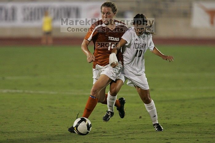 UT senior Kasey Moore (#14, Defender) brings the ball downfield.  The University of Texas women's soccer team tied 0-0 against the Texas A&M Aggies Friday night, September 27, 2008.

Filename: SRM_20080926_1935440.jpg
Aperture: f/4.0
Shutter Speed: 1/400
Body: Canon EOS-1D Mark II
Lens: Canon EF 300mm f/2.8 L IS