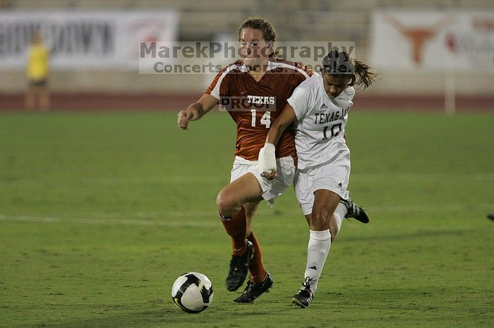 UT senior Kasey Moore (#14, Defender) brings the ball downfield.  The University of Texas women's soccer team tied 0-0 against the Texas A&M Aggies Friday night, September 27, 2008.

Filename: SRM_20080926_1935449.jpg
Aperture: f/4.0
Shutter Speed: 1/500
Body: Canon EOS-1D Mark II
Lens: Canon EF 300mm f/2.8 L IS