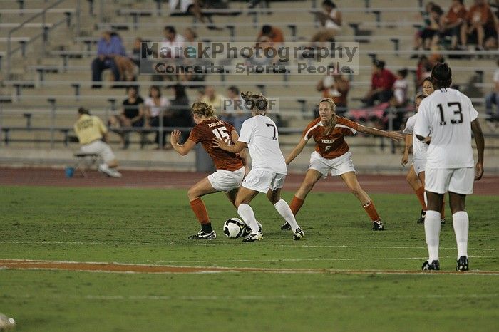 UT freshman Kylie Doniak (#15, Midfielder) tries to turn the ball as UT freshman Lucy Keith (#6, Midfielder) gives her support.  The University of Texas women's soccer team tied 0-0 against the Texas A&M Aggies Friday night, September 27, 2008.

Filename: SRM_20080926_1936588.jpg
Aperture: f/4.0
Shutter Speed: 1/500
Body: Canon EOS-1D Mark II
Lens: Canon EF 300mm f/2.8 L IS