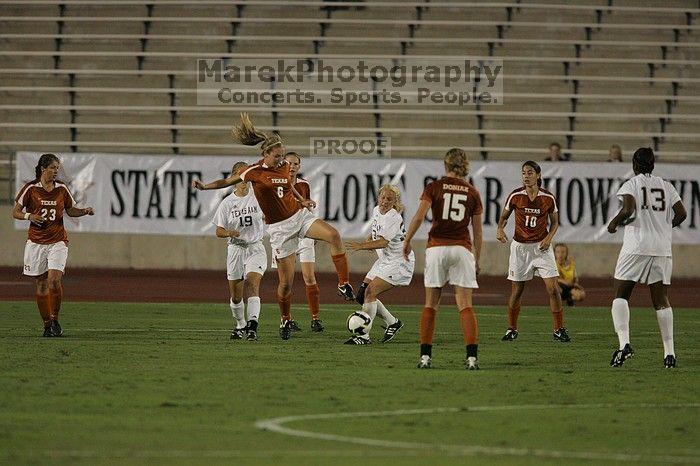 UT freshman Lucy Keith (#6, Midfielder) settles the ball as UT senior Stephanie Logterman (#10, Defender), UT freshman Kylie Doniak (#15, Midfielder), UT senior Courtney Gaines (#23, Midfielder) watch.  The University of Texas women's soccer team tied 0-0 against the Texas A&M Aggies Friday night, September 27, 2008.

Filename: SRM_20080926_1940029.jpg
Aperture: f/4.0
Shutter Speed: 1/640
Body: Canon EOS-1D Mark II
Lens: Canon EF 300mm f/2.8 L IS