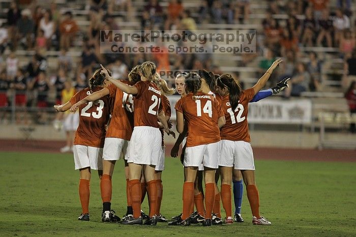 UT senior Courtney Gaines (#23, Midfielder), UT freshman Kylie Doniak (#15, Midfielder), UT junior Emily Anderson (#21, Forward), UT senior Kasey Moore (#14, Defender), UT sophomore Alisha Ortiz (#12, Forward), UT senior Dianna Pfenninger (#8, Goalkeeper) get ready for the start of the second half.  The University of Texas women's soccer team tied 0-0 against the Texas A&M Aggies Friday night, September 27, 2008.

Filename: SRM_20080926_2003046.jpg
Aperture: f/2.8
Shutter Speed: 1/500
Body: Canon EOS-1D Mark II
Lens: Canon EF 300mm f/2.8 L IS