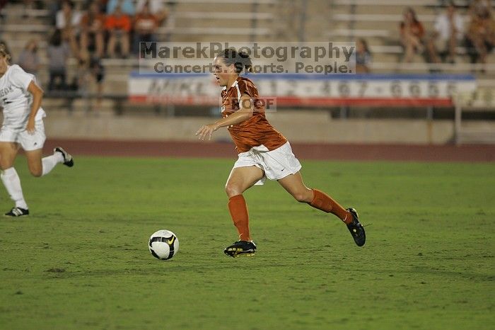 UT senior Kasey Moore (#14, Defender).  The University of Texas women's soccer team tied 0-0 against the Texas A&M Aggies Friday night, September 27, 2008.

Filename: SRM_20080926_2012103.jpg
Aperture: f/2.8
Shutter Speed: 1/500
Body: Canon EOS-1D Mark II
Lens: Canon EF 300mm f/2.8 L IS