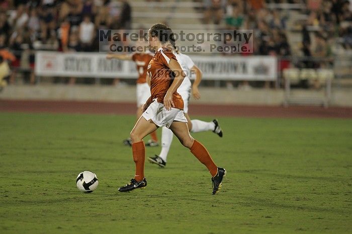 UT senior Kasey Moore (#14, Defender).  The University of Texas women's soccer team tied 0-0 against the Texas A&M Aggies Friday night, September 27, 2008.

Filename: SRM_20080926_2012128.jpg
Aperture: f/2.8
Shutter Speed: 1/500
Body: Canon EOS-1D Mark II
Lens: Canon EF 300mm f/2.8 L IS