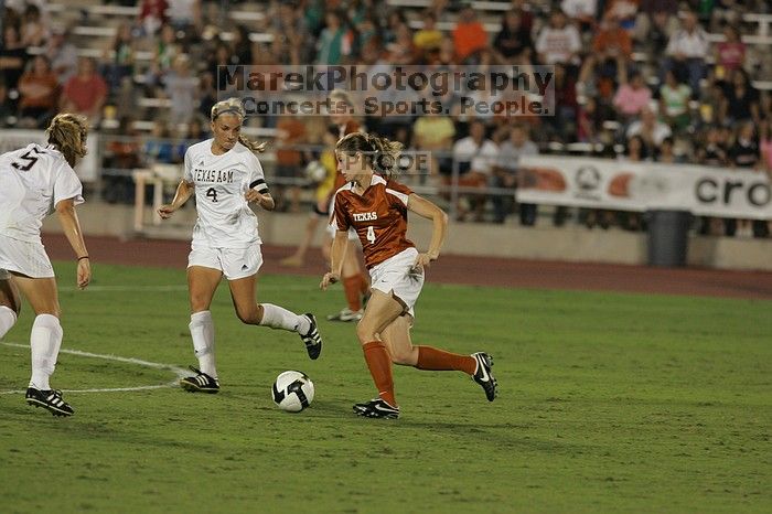 UT senior Jill Gilbeau (#4, Defender and Midfielder).  The University of Texas women's soccer team tied 0-0 against the Texas A&M Aggies Friday night, September 27, 2008.

Filename: SRM_20080926_2019583.jpg
Aperture: f/4.0
Shutter Speed: 1/400
Body: Canon EOS-1D Mark II
Lens: Canon EF 300mm f/2.8 L IS