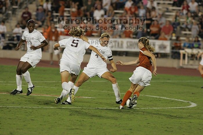 UT senior Jill Gilbeau (#4, Defender and Midfielder).  The University of Texas women's soccer team tied 0-0 against the Texas A&M Aggies Friday night, September 27, 2008.

Filename: SRM_20080926_2019586.jpg
Aperture: f/4.0
Shutter Speed: 1/400
Body: Canon EOS-1D Mark II
Lens: Canon EF 300mm f/2.8 L IS