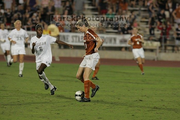 UT sophomore Niki Arlitt (#11, Forward).  The University of Texas women's soccer team tied 0-0 against the Texas A&M Aggies Friday night, September 27, 2008.

Filename: SRM_20080926_2021567.jpg
Aperture: f/4.0
Shutter Speed: 1/400
Body: Canon EOS-1D Mark II
Lens: Canon EF 300mm f/2.8 L IS