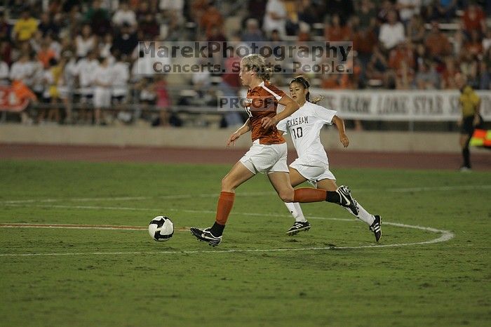 UT freshman Kylie Doniak (#15, Midfielder).  The University of Texas women's soccer team tied 0-0 against the Texas A&M Aggies Friday night, September 27, 2008.

Filename: SRM_20080926_2031483.jpg
Aperture: f/2.8
Shutter Speed: 1/640
Body: Canon EOS-1D Mark II
Lens: Canon EF 300mm f/2.8 L IS