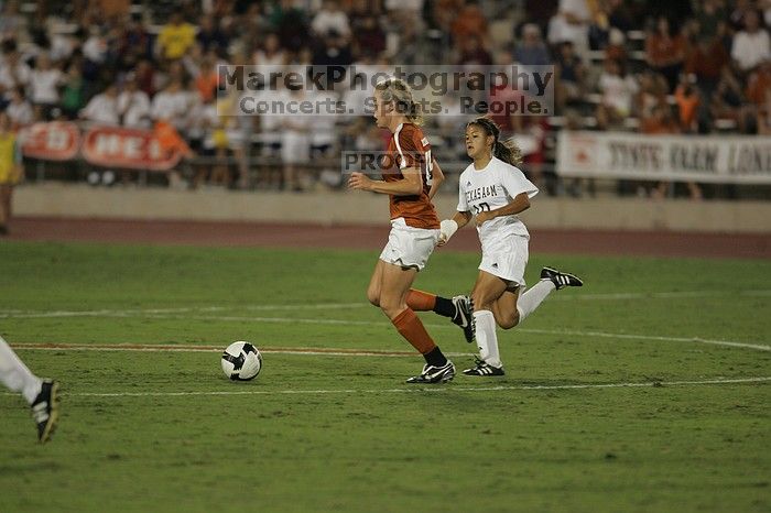 UT freshman Kylie Doniak (#15, Midfielder).  The University of Texas women's soccer team tied 0-0 against the Texas A&M Aggies Friday night, September 27, 2008.

Filename: SRM_20080926_2031484.jpg
Aperture: f/2.8
Shutter Speed: 1/640
Body: Canon EOS-1D Mark II
Lens: Canon EF 300mm f/2.8 L IS