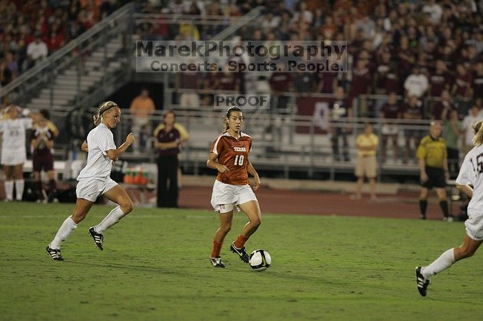 UT senior Stephanie Logterman (#10, Defender).  The University of Texas women's soccer team tied 0-0 against the Texas A&M Aggies Friday night, September 27, 2008.

Filename: SRM_20080926_2048285.jpg
Aperture: f/2.8
Shutter Speed: 1/500
Body: Canon EOS-1D Mark II
Lens: Canon EF 300mm f/2.8 L IS