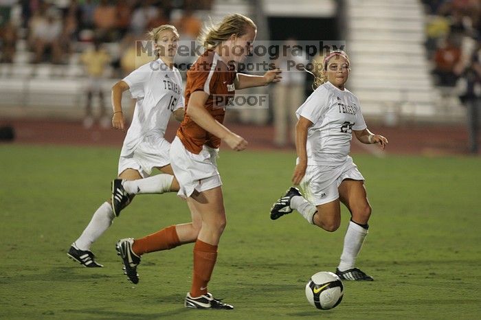 UT freshman Courtney Goodson (#7, Forward and Midfielder) takes the ball down the field.  The University of Texas women's soccer team tied 0-0 against the Texas A&M Aggies Friday night, September 27, 2008.

Filename: SRM_20080926_2048326.jpg
Aperture: f/2.8
Shutter Speed: 1/500
Body: Canon EOS-1D Mark II
Lens: Canon EF 300mm f/2.8 L IS