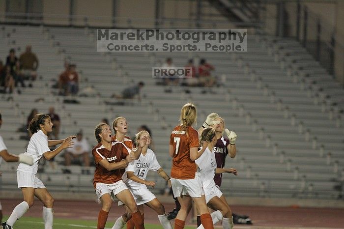 A&M goalkeeper catches another shot on goal as UT senior Kasey Moore (#14, Defender) and UT freshman Lucy Keith (#6, Midfielder) attempt the header and UT freshman Courtney Goodson (#7, Forward and Midfielder) watches.  The University of Texas women's soccer team tied 0-0 against the Texas A&M Aggies Friday night, September 27, 2008.

Filename: SRM_20080926_2049487.jpg
Aperture: f/2.8
Shutter Speed: 1/500
Body: Canon EOS-1D Mark II
Lens: Canon EF 300mm f/2.8 L IS