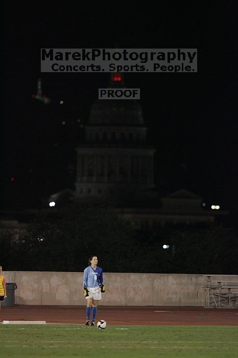 UT senior Dianna Pfenninger (#8, Goalkeeper) takes a goal kick with the capitol in the background.  The University of Texas women's soccer team tied 0-0 against the Texas A&M Aggies Friday night, September 27, 2008.

Filename: SRM_20080926_2050166.jpg
Aperture: f/2.8
Shutter Speed: 1/500
Body: Canon EOS-1D Mark II
Lens: Canon EF 300mm f/2.8 L IS