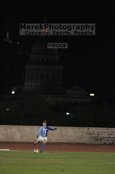 UT senior Dianna Pfenninger (#8, Goalkeeper) takes a goal kick with the capitol in the background.  The University of Texas women's soccer team tied 0-0 against the Texas A&M Aggies Friday night, September 27, 2008.

Filename: SRM_20080926_2050187.jpg
Aperture: f/2.8
Shutter Speed: 1/500
Body: Canon EOS-1D Mark II
Lens: Canon EF 300mm f/2.8 L IS