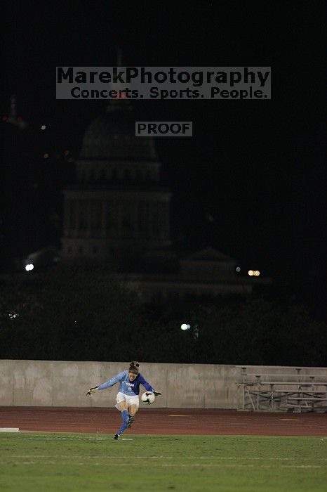 UT senior Dianna Pfenninger (#8, Goalkeeper) takes a goal kick with the capitol in the background.  The University of Texas women's soccer team tied 0-0 against the Texas A&M Aggies Friday night, September 27, 2008.

Filename: SRM_20080926_2050189.jpg
Aperture: f/2.8
Shutter Speed: 1/500
Body: Canon EOS-1D Mark II
Lens: Canon EF 300mm f/2.8 L IS