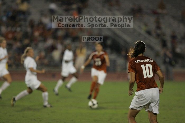 UT senior Stephanie Logterman (#10, Defender) waits for a pass from UT senior Courtney Gaines (#23, Midfielder).  The University of Texas women's soccer team tied 0-0 against the Texas A&M Aggies Friday night, September 27, 2008.

Filename: SRM_20080926_2056044.jpg
Aperture: f/2.8
Shutter Speed: 1/640
Body: Canon EOS-1D Mark II
Lens: Canon EF 300mm f/2.8 L IS