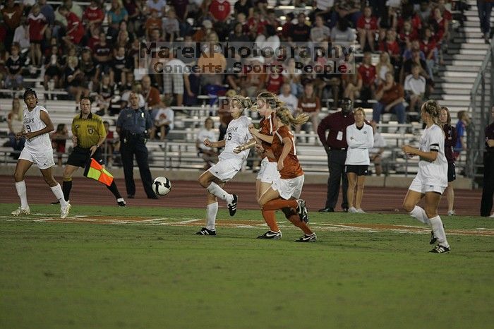 UT freshman Courtney Goodson (#7, Forward and Midfielder) tries to steal the ball as UT sophomore Niki Arlitt (#11, Forward) watches.  The University of Texas women's soccer team tied 0-0 against the Texas A&M Aggies Friday night, September 27, 2008.

Filename: SRM_20080926_2056526.jpg
Aperture: f/2.8
Shutter Speed: 1/640
Body: Canon EOS-1D Mark II
Lens: Canon EF 300mm f/2.8 L IS