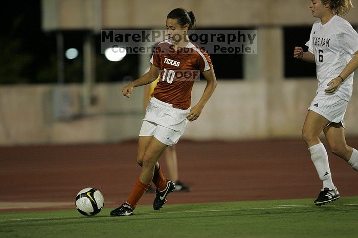 UT senior Stephanie Logterman (#10, Defender).  The University of Texas women's soccer team tied 0-0 against the Texas A&M Aggies Friday night, September 27, 2008.

Filename: SRM_20080926_2058024.jpg
Aperture: f/2.8
Shutter Speed: 1/640
Body: Canon EOS-1D Mark II
Lens: Canon EF 300mm f/2.8 L IS