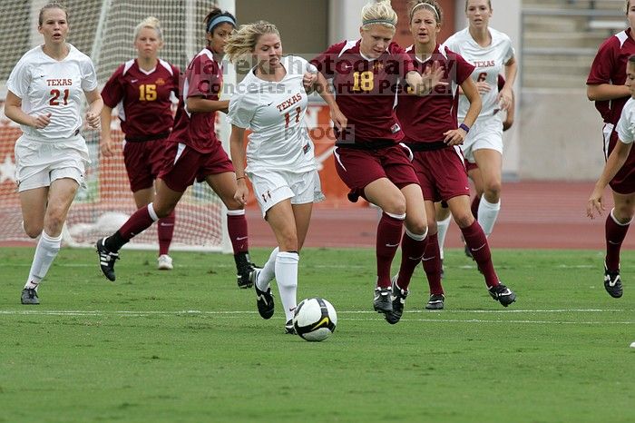 UT sophomore Niki Arlitt (#11, Forward) passes the ball to UT sophomore Alisha Ortiz (#12, Forward).  The University of Texas women's soccer team won 2-1 against the Iowa State Cyclones Sunday afternoon, October 5, 2008.

Filename: SRM_20081005_11594490.jpg
Aperture: f/8.0
Shutter Speed: 1/640
Body: Canon EOS-1D Mark II
Lens: Canon EF 300mm f/2.8 L IS