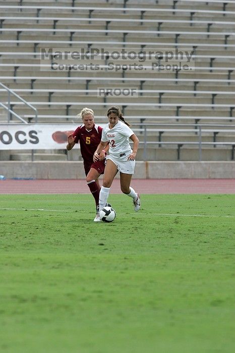 UT sophomore Alisha Ortiz (#12, Forward).  The University of Texas women's soccer team won 2-1 against the Iowa State Cyclones Sunday afternoon, October 5, 2008.

Filename: SRM_20081005_12115856.jpg
Aperture: f/5.6
Shutter Speed: 1/1600
Body: Canon EOS-1D Mark II
Lens: Canon EF 300mm f/2.8 L IS