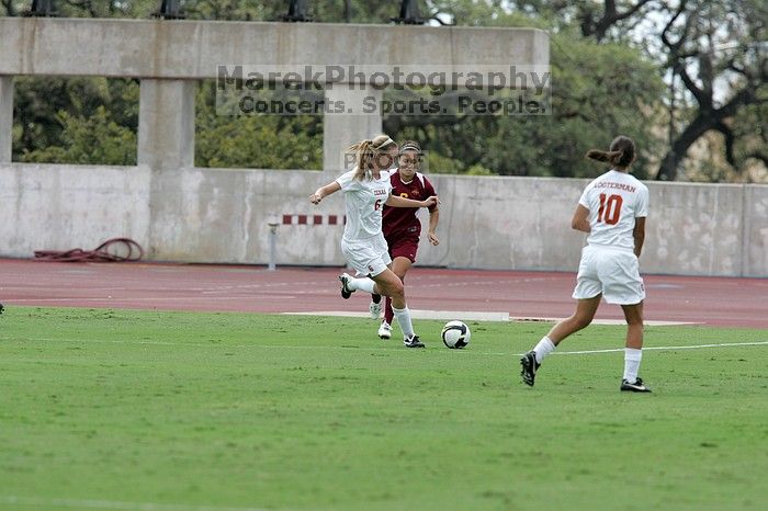 UT freshman Lucy Keith (#6, Midfielder) passes to UT senior Stephanie Logterman (#10, Defender).  The University of Texas women's soccer team won 2-1 against the Iowa State Cyclones Sunday afternoon, October 5, 2008.

Filename: SRM_20081005_12122473.jpg
Aperture: f/5.6
Shutter Speed: 1/1600
Body: Canon EOS-1D Mark II
Lens: Canon EF 300mm f/2.8 L IS