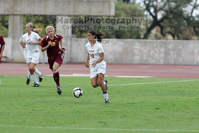 UT freshman Lucy Keith (#6, Midfielder) passes to UT senior Stephanie Logterman (#10, Defender).  The University of Texas women's soccer team won 2-1 against the Iowa State Cyclones Sunday afternoon, October 5, 2008.

Filename: SRM_20081005_12122876.jpg
Aperture: f/5.6
Shutter Speed: 1/1600
Body: Canon EOS-1D Mark II
Lens: Canon EF 300mm f/2.8 L IS