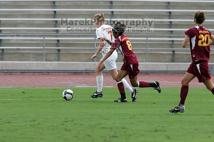 UT freshman Courtney Goodson (#7, Forward and Midfielder) takes the ball down the sideline.  The University of Texas women's soccer team won 2-1 against the Iowa State Cyclones Sunday afternoon, October 5, 2008.

Filename: SRM_20081005_12153221.jpg
Aperture: f/5.6
Shutter Speed: 1/1250
Body: Canon EOS-1D Mark II
Lens: Canon EF 300mm f/2.8 L IS