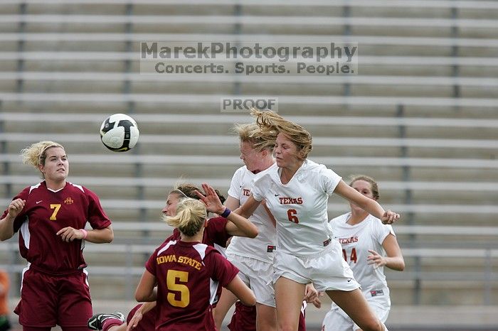 UT freshman Lucy Keith (#6, Midfielder) and UT freshman Courtney Goodson (#7, Forward and Midfielder) fight for the header as UT senior Kasey Moore (#14, Defender) watches.  Keith makes contact, which was an assist to UT junior Emily Anderson (#21, Forward).  The University of Texas women's soccer team won 2-1 against the Iowa State Cyclones Sunday afternoon, October 5, 2008.

Filename: SRM_20081005_12210086.jpg
Aperture: f/5.0
Shutter Speed: 1/1600
Body: Canon EOS-1D Mark II
Lens: Canon EF 300mm f/2.8 L IS