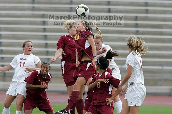 UT freshman Courtney Goodson (#7, Forward and Midfielder) attempts a header while UT senior Kasey Moore (#14, Defender) and UT freshman Lucy Keith (#6, Midfielder) watch.  The University of Texas women's soccer team won 2-1 against the Iowa State Cyclones Sunday afternoon, October 5, 2008.

Filename: SRM_20081005_12235033.jpg
Aperture: f/5.6
Shutter Speed: 1/1000
Body: Canon EOS-1D Mark II
Lens: Canon EF 300mm f/2.8 L IS