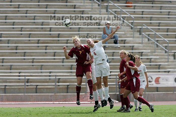 UT freshman Lucy Keith (#6, Midfielder) fights for the header as UT senior Jill Gilbeau (#4, Defender and Midfielder) watches.  The University of Texas women's soccer team won 2-1 against the Iowa State Cyclones Sunday afternoon, October 5, 2008.

Filename: SRM_20081005_12313698.jpg
Aperture: f/5.6
Shutter Speed: 1/2000
Body: Canon EOS-1D Mark II
Lens: Canon EF 300mm f/2.8 L IS