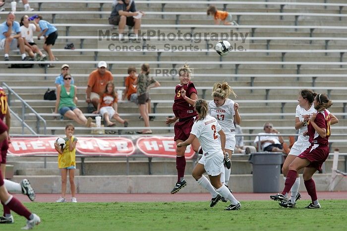 UT sophomore Kirsten Birkhold (#2, Forward and Midfielder) and UT sophomore Kate Nicholson (#17, Forward and Midfielder) fight for the header as UT junior Stephanie Gibson (#22, Defense and Forward) watches.  The University of Texas women's soccer team won 2-1 against the Iowa State Cyclones Sunday afternoon, October 5, 2008.

Filename: SRM_20081005_12410098.jpg
Aperture: f/5.6
Shutter Speed: 1/1250
Body: Canon EOS-1D Mark II
Lens: Canon EF 300mm f/2.8 L IS