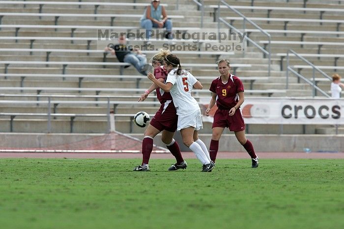 UT sophomore Kendall Campise (#5, Defender and Midfielder) plays defense on an Iowa State player.  The University of Texas women's soccer team won 2-1 against the Iowa State Cyclones Sunday afternoon, October 5, 2008.

Filename: SRM_20081005_12410201.jpg
Aperture: f/5.6
Shutter Speed: 1/1250
Body: Canon EOS-1D Mark II
Lens: Canon EF 300mm f/2.8 L IS