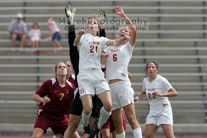 UT junior Emily Anderson (#21, Forward) and UT freshman Lucy Keith (#6, Midfielder) fight for the header with the keeper, as UT junior Stephanie Gibson (#22, Defense and Forward) watches.  The University of Texas women's soccer team won 2-1 against the Iowa State Cyclones Sunday afternoon, October 5, 2008.

Filename: SRM_20081005_12420420.jpg
Aperture: f/5.6
Shutter Speed: 1/1600
Body: Canon EOS-1D Mark II
Lens: Canon EF 300mm f/2.8 L IS