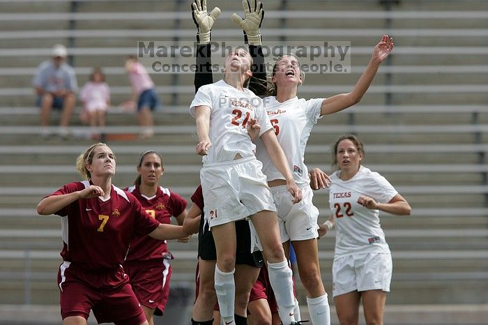 UT junior Emily Anderson (#21, Forward) and UT freshman Lucy Keith (#6, Midfielder) fight for the header with the keeper, as UT junior Stephanie Gibson (#22, Defense and Forward) watches.  The University of Texas women's soccer team won 2-1 against the Iowa State Cyclones Sunday afternoon, October 5, 2008.

Filename: SRM_20081005_12420421.jpg
Aperture: f/5.6
Shutter Speed: 1/2000
Body: Canon EOS-1D Mark II
Lens: Canon EF 300mm f/2.8 L IS