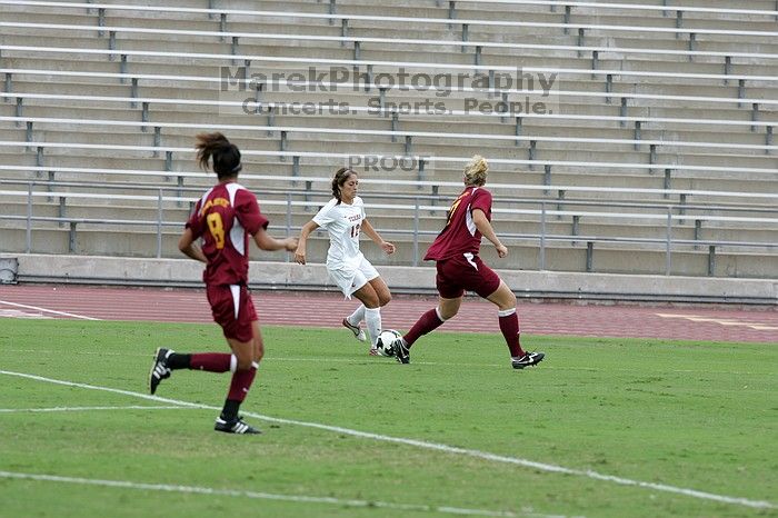 UT sophomore Alisha Ortiz (#12, Forward) in the second half.  The University of Texas women's soccer team won 2-1 against the Iowa State Cyclones Sunday afternoon, October 5, 2008.

Filename: SRM_20081005_13014678.jpg
Aperture: f/5.6
Shutter Speed: 1/1250
Body: Canon EOS-1D Mark II
Lens: Canon EF 300mm f/2.8 L IS