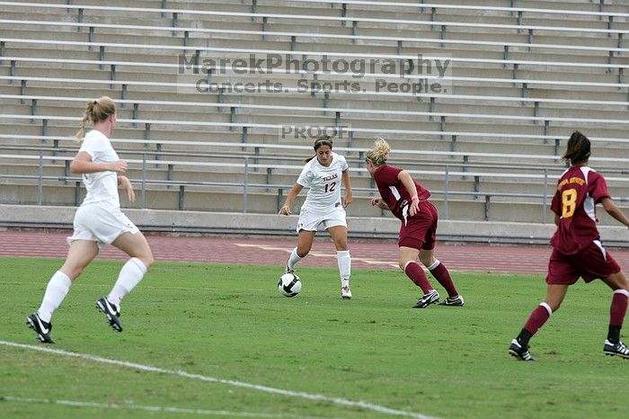 UT sophomore Alisha Ortiz (#12, Forward) in the second half.  The University of Texas women's soccer team won 2-1 against the Iowa State Cyclones Sunday afternoon, October 5, 2008.

Filename: SRM_20081005_13014883.jpg
Aperture: f/5.6
Shutter Speed: 1/1250
Body: Canon EOS-1D Mark II
Lens: Canon EF 300mm f/2.8 L IS