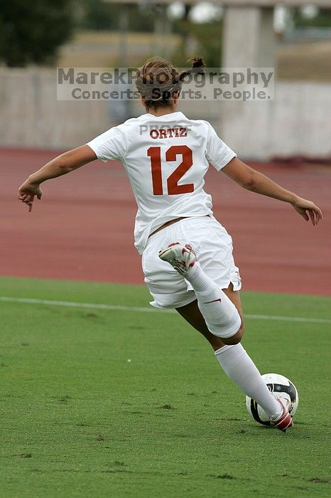 UT sophomore Alisha Ortiz (#12, Forward) in the second half.  The University of Texas women's soccer team won 2-1 against the Iowa State Cyclones Sunday afternoon, October 5, 2008.

Filename: SRM_20081005_13030221.jpg
Aperture: f/5.6
Shutter Speed: 1/1600
Body: Canon EOS-1D Mark II
Lens: Canon EF 300mm f/2.8 L IS