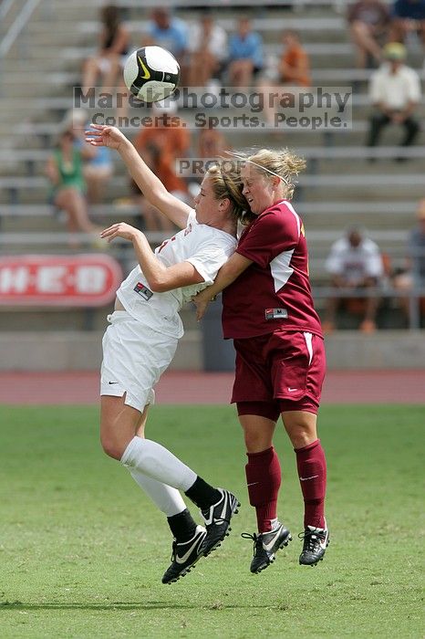 UT freshman Kylie Doniak (#15, Midfielder) fights for the header in the second half.  The University of Texas women's soccer team won 2-1 against the Iowa State Cyclones Sunday afternoon, October 5, 2008.

Filename: SRM_20081005_13091426.jpg
Aperture: f/5.6
Shutter Speed: 1/1600
Body: Canon EOS-1D Mark II
Lens: Canon EF 300mm f/2.8 L IS