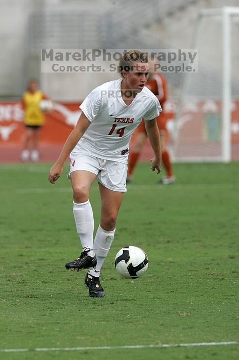 UT senior Kasey Moore (#14, Defender) in the second half.  The University of Texas women's soccer team won 2-1 against the Iowa State Cyclones Sunday afternoon, October 5, 2008.

Filename: SRM_20081005_13092432.jpg
Aperture: f/5.6
Shutter Speed: 1/2000
Body: Canon EOS-1D Mark II
Lens: Canon EF 300mm f/2.8 L IS