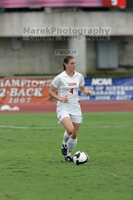 UT senior Jill Gilbeau (#4, Defender and Midfielder) dribbles the ball in the second half.  The University of Texas women's soccer team won 2-1 against the Iowa State Cyclones Sunday afternoon, October 5, 2008.

Filename: SRM_20081005_13145801.jpg
Aperture: f/5.6
Shutter Speed: 1/1250
Body: Canon EOS-1D Mark II
Lens: Canon EF 300mm f/2.8 L IS