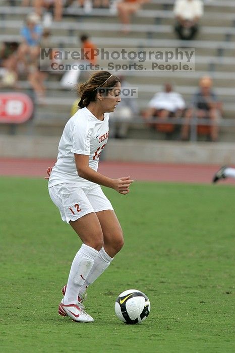 UT sophomore Alisha Ortiz (#12, Forward) in the second half.  The University of Texas women's soccer team won 2-1 against the Iowa State Cyclones Sunday afternoon, October 5, 2008.

Filename: SRM_20081005_13150616.jpg
Aperture: f/5.6
Shutter Speed: 1/1250
Body: Canon EOS-1D Mark II
Lens: Canon EF 300mm f/2.8 L IS