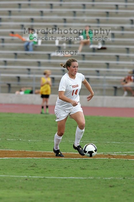 UT senior Kasey Moore (#14, Defender) takes the ball upfield in the second half.  The University of Texas women's soccer team won 2-1 against the Iowa State Cyclones Sunday afternoon, October 5, 2008.

Filename: SRM_20081005_13174857.jpg
Aperture: f/5.6
Shutter Speed: 1/1250
Body: Canon EOS-1D Mark II
Lens: Canon EF 300mm f/2.8 L IS