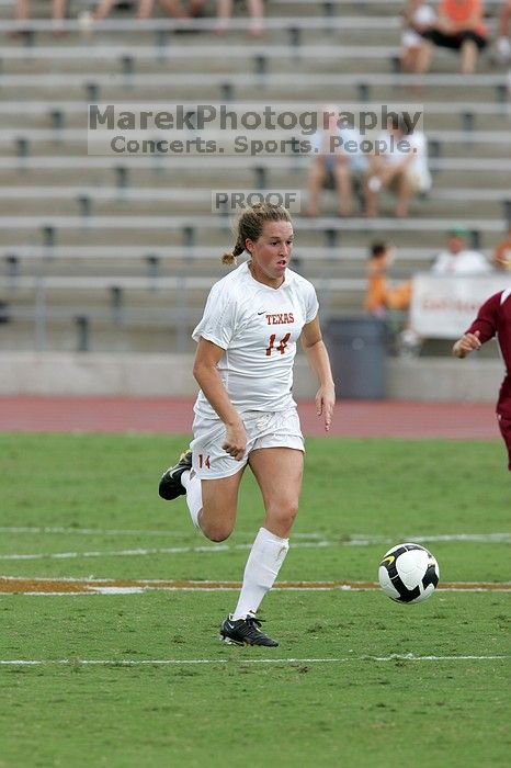 UT senior Kasey Moore (#14, Defender) takes the ball upfield in the second half.  The University of Texas women's soccer team won 2-1 against the Iowa State Cyclones Sunday afternoon, October 5, 2008.

Filename: SRM_20081005_13175263.jpg
Aperture: f/5.6
Shutter Speed: 1/1000
Body: Canon EOS-1D Mark II
Lens: Canon EF 300mm f/2.8 L IS