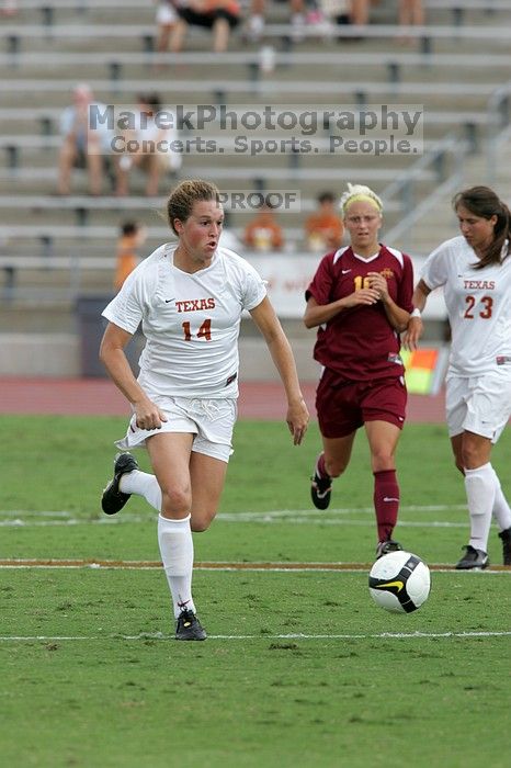 UT senior Kasey Moore (#14, Defender) takes the ball upfield in the second half.  The University of Texas women's soccer team won 2-1 against the Iowa State Cyclones Sunday afternoon, October 5, 2008.

Filename: SRM_20081005_13175265.jpg
Aperture: f/5.6
Shutter Speed: 1/1250
Body: Canon EOS-1D Mark II
Lens: Canon EF 300mm f/2.8 L IS